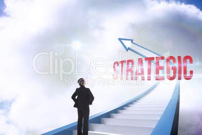 Strategic against red staircase arrow pointing up against sky