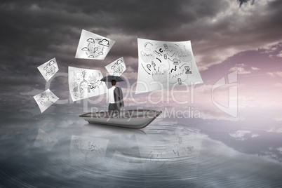 Composite image of businessman standing in a sailboat