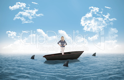 Composite image of thoughtful gorgeous blonde in a sailboat