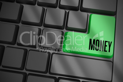 Money on black keyboard with green key