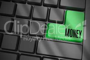 Money on black keyboard with green key