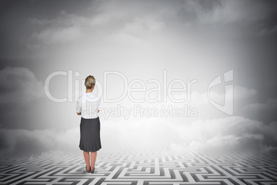 Composite image of thinking businesswoman