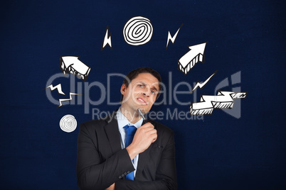 Composite image of thinking businessman holding pen