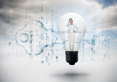 Composite image of thinking businesswoman in light bulb