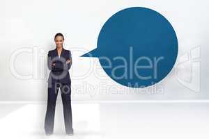 Composite image of confident businesswoman with speech bubble