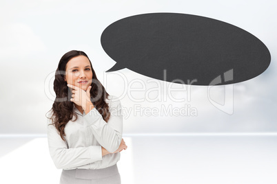 Composite image of portrait of a businesswoman posing with speec