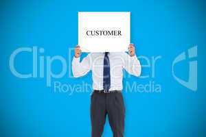 Businessman holding card saying customer