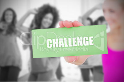 Fit blonde holding card saying challenge