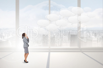 Composite image of focused businesswoman