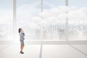 Composite image of focused businesswoman