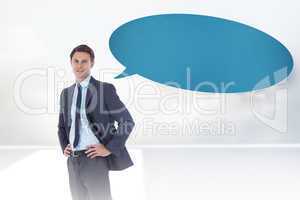 Composite image of smiling businessman with speech bubble