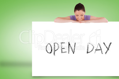 Pretty brunette showing card with open day