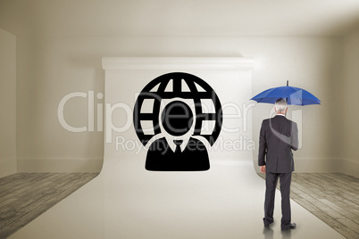 Composite image of businessman holding umbrella