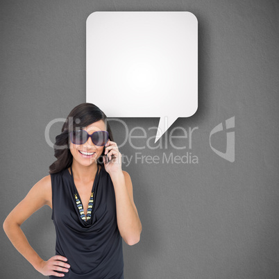 Composite image of happy brunette phoning