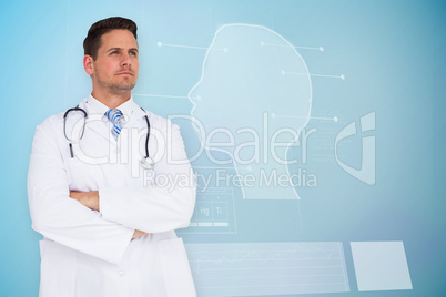 Composite image of handsome doctor with arms crossed