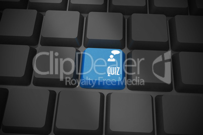 Quiz on black keyboard with blue key