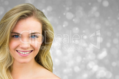 Composite image of smiling blonde natural beauty