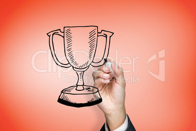 Composite image of businessman drawing winners cup