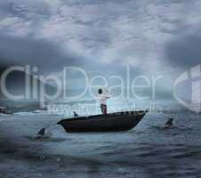 Composite image of businessman posing with arms up in a sailboat