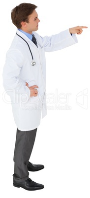 Young doctor in lab coat pointing