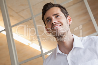 Casual businessman standing with happy expression