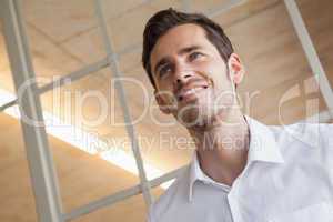 Casual businessman standing with happy expression