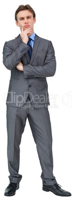 Thinking young businessman in grey suit