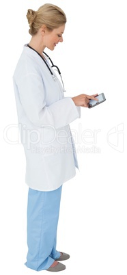 Blonde doctor in lab coat using tablet pc Blonde doctor in lab coat using tablet pc