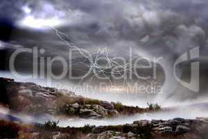 Stormy sky with tornado over landscape