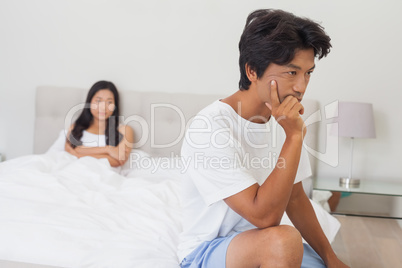 Couple not talking after argument in bed