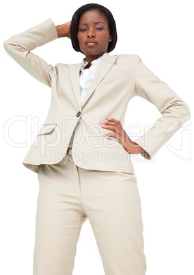 Thinking businesswoman in cream suit