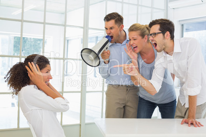 Casual business team shouting at a colleague