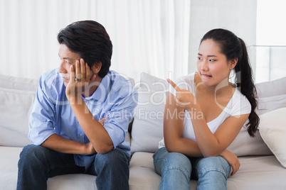 Couple having a dispute on the sofa