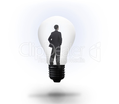 Thinking businessman in light bulb