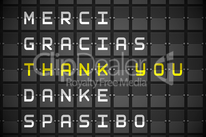 Thank you in languages on black mechanical board