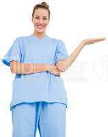 Pretty surgeon in blue scrubs presenting