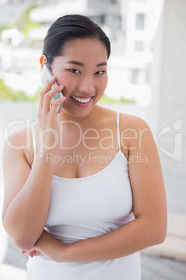 Happy woman talking on phone
