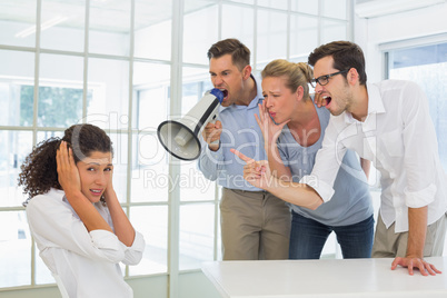 Casual business team shouting at a colleague