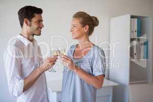 Casual business team toasting with champagne