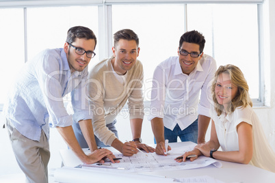 Casual architecture team working together smiling at camera