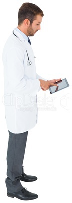 Handsome young doctor using tablet pc