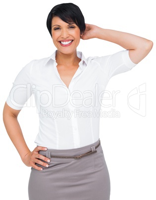 Thoughtful brown haired businesswoman in skirt