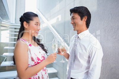 Happy couple toasting with champagne