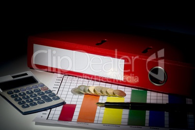 Red business binder on a desk