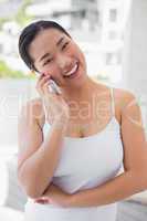 Happy woman talking on phone