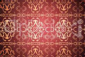 Elegant patterned wallpaper in red and gold