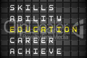 Education buzzwords on black mechanical board