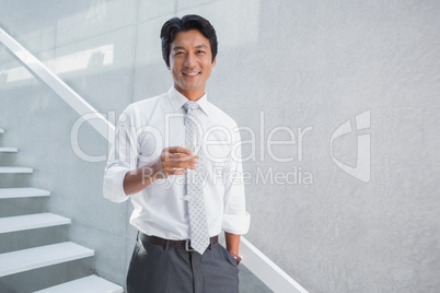 Happy man holding flute of champagne