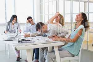 Casual business team laughing during meeting