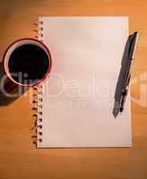 Overhead of graph paper coffee and pen
